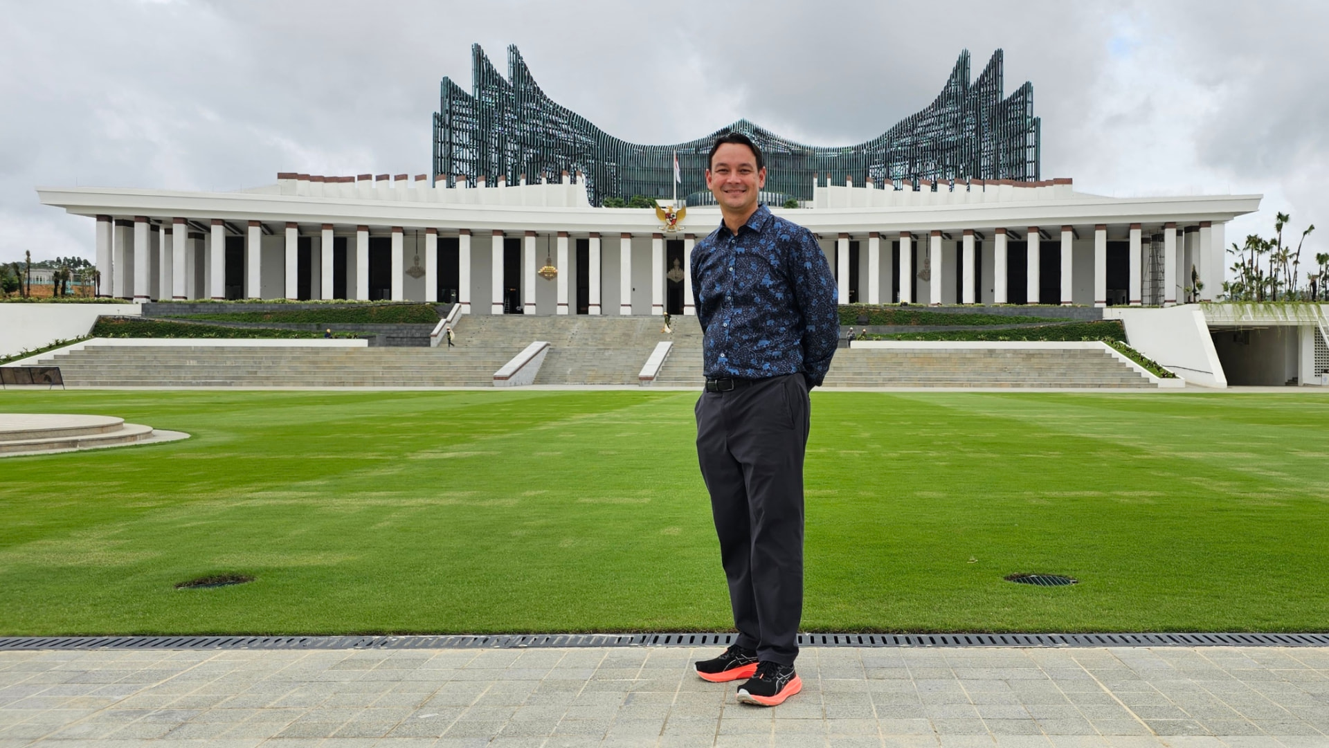Charles Elwood standing outside the Presidential Palace in Nusantara, Indonesia